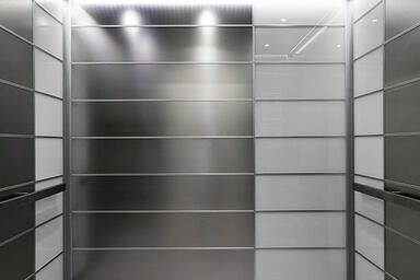 LEVELe-103 Elevator Interior with main panels in Stainless Steel, Seastone finis