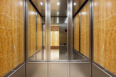 LEVELc-2000N Elevator Interior with rear wall upper inset panels in St